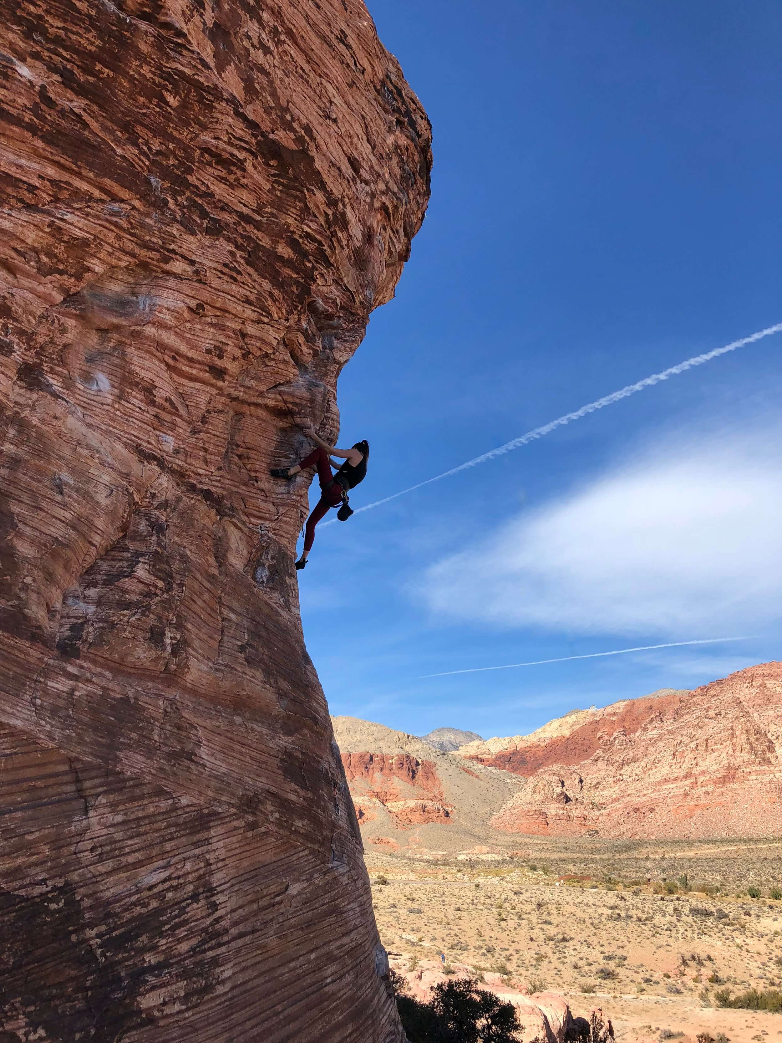 Maya Kumits sport climbing Caustic at Calico Basin, Red Rock Canyon, Nevada