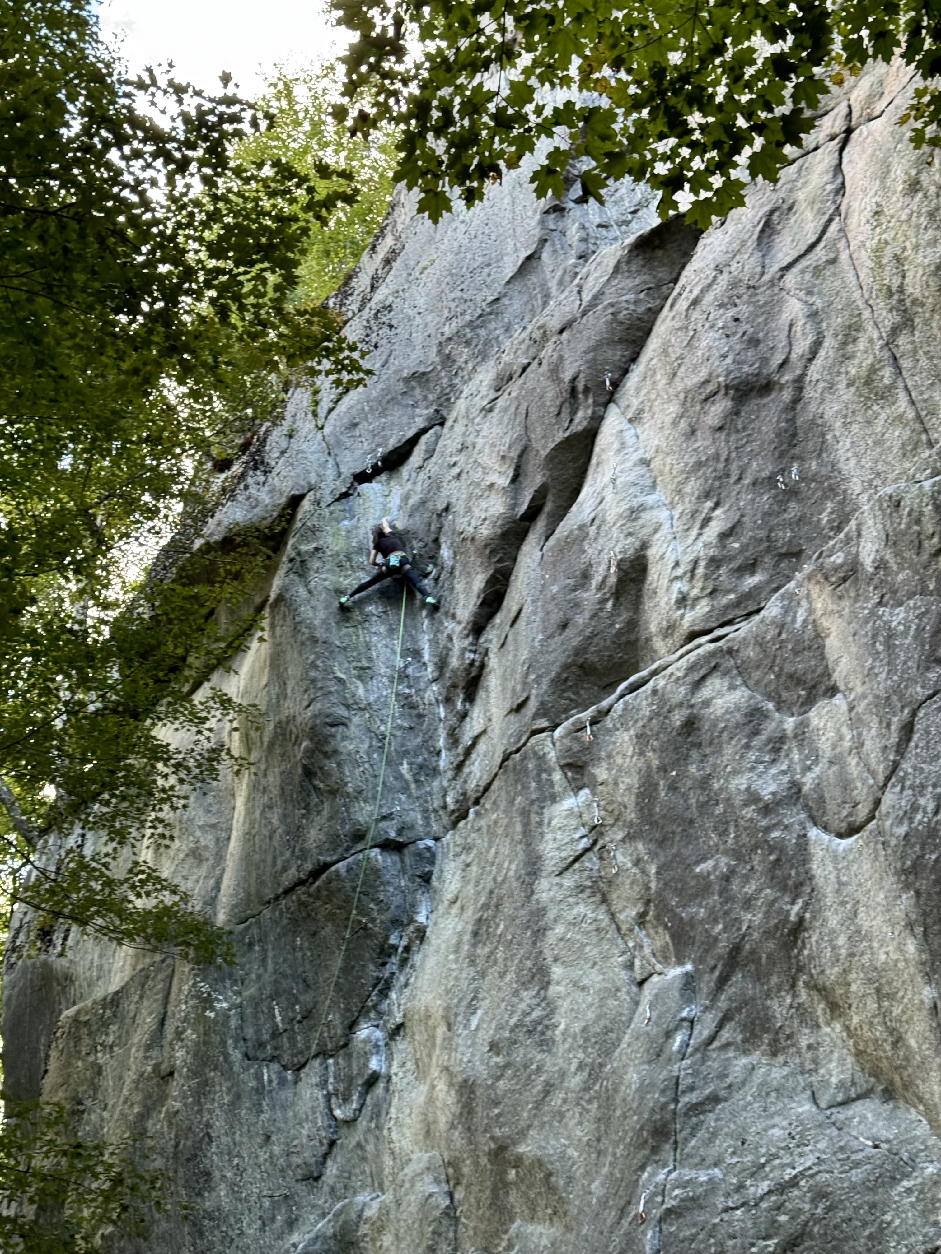 Maya Kumits sport climbing Eminent Domain at Hanging Mountain in the Berkshires, Massachusetts